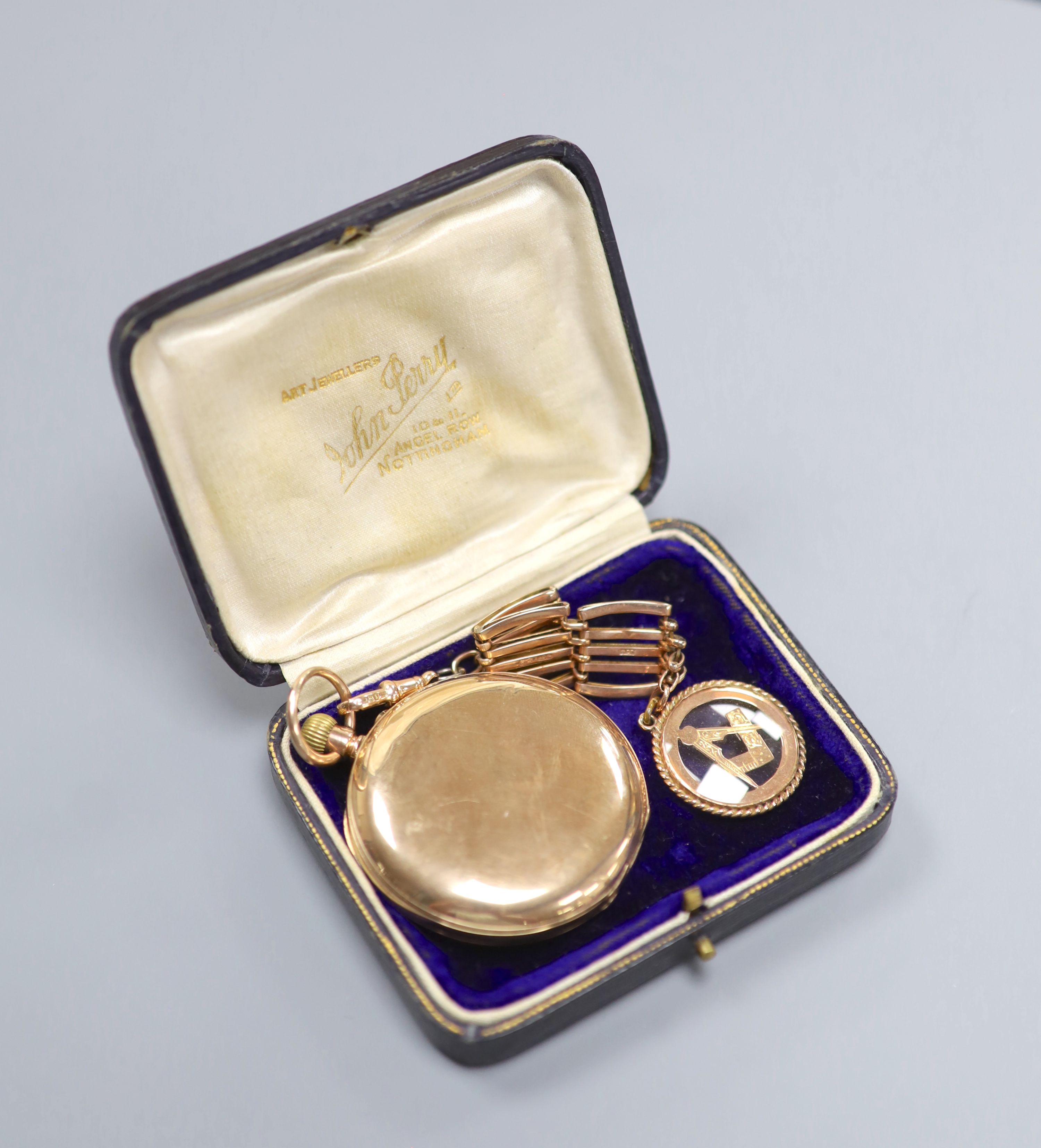 A 20th century 9ct gold hunter keyless pocket watch, on a 9ct gold chain with masonic charm